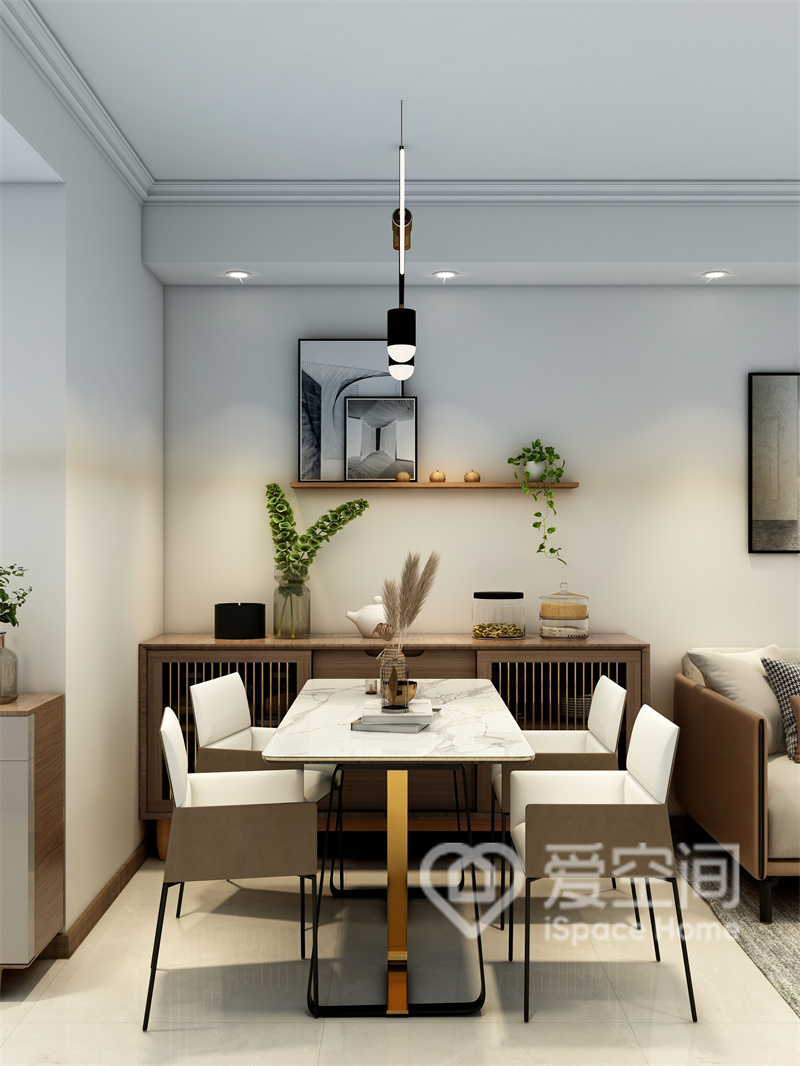 餐厅选用优雅时尚的餐桌椅，餐边柜造型简雅，摆件与灯具搭配组合，呈现出层次丰富的用餐空间。
