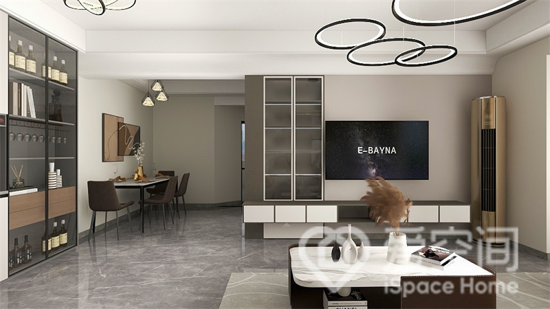 电视墙采用经典的米、咖、白色调搭配，局部添加了收纳柜，地柜采用悬浮设计处理，彰显出的层次氛围。