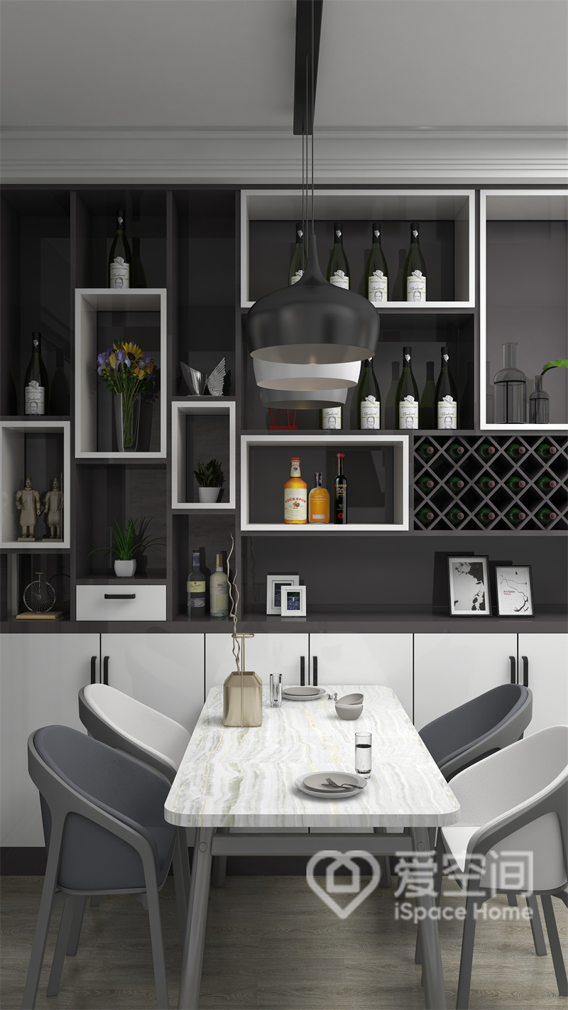餐厅以黑白灰冷调为主色，整个区域明亮通透，餐边柜简洁大气，简约的餐桌椅带来舒适的视觉效果。