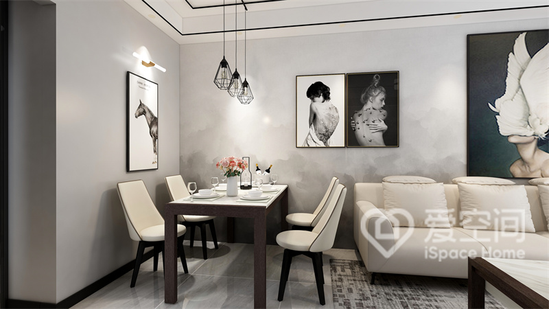 餐椅的设计延续了白色格调，灰色质感的背景墙搭配白色装饰画，塑造出恬淡的用餐空间。