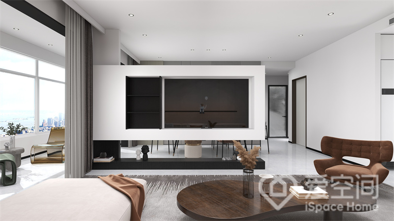电视墙黑白撞色设计，时尚大方，悬浮式隔断设计强化了空间层次，令客厅看上去更有设计感。