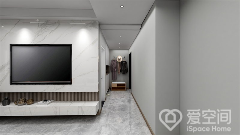 白色大理石增强了客厅的韵律感，中部电视机嵌入设计，地台悬浮，整体给人上档次的美感。