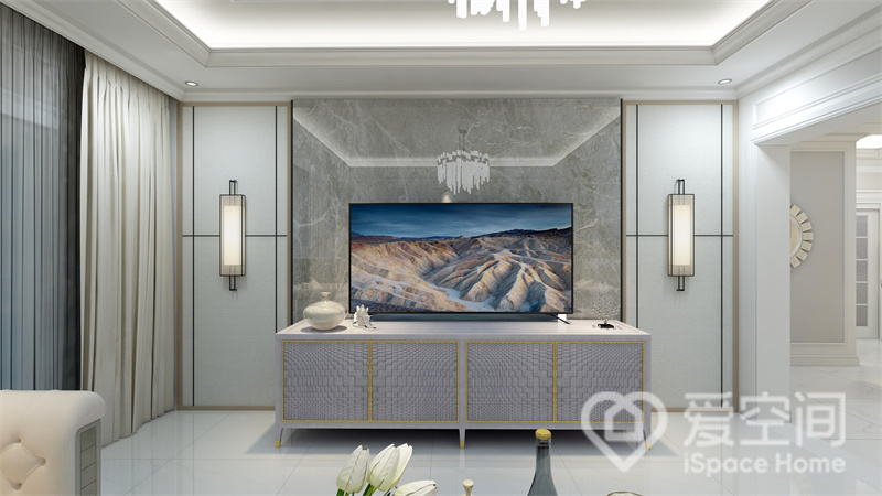 电视墙运用对称手法演绎，石材与护墙板的结合打造出奢而不华的视觉效果，地柜精致优雅，增添了视觉层次。