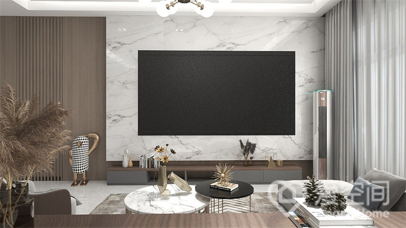 黑与白色碰撞衬托出客厅空间的简约格调，电视嵌入式设计，保持了立面的整洁，地柜纤细，美观度高。