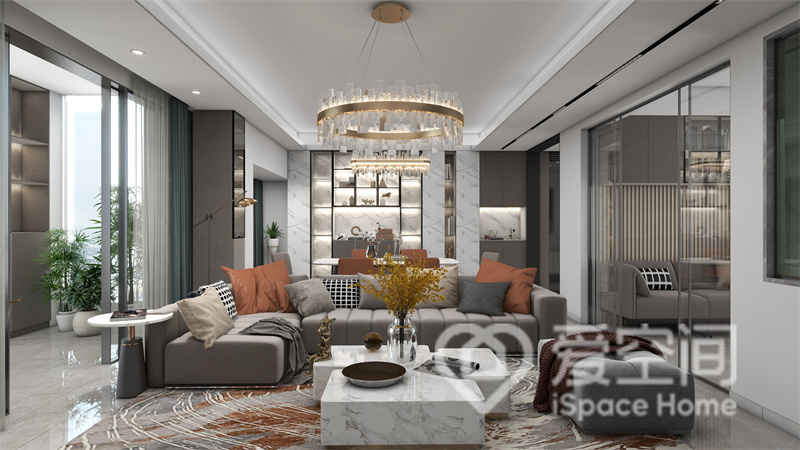 灰色沙发尽显高雅，给人一种时尚的意境，白色茶几、花色地毯和水晶灯，构建出优雅的空间氛围。