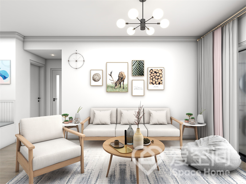 白色背景描摹出欢愉温馨的客厅氛围，木质家具带来简单干净的视觉效果，装饰画强化了空间的精致感。