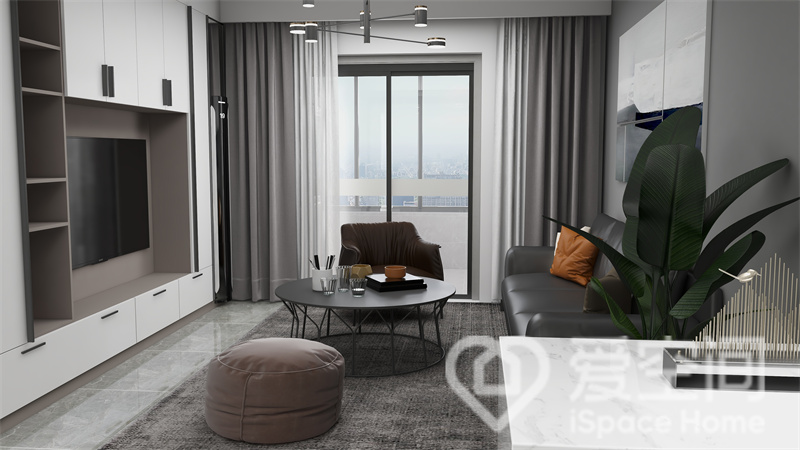 客厅以简约安静的黑白为主色，电视墙增添了储物功能，绿植和灯具让人感受明亮温馨、简雅舒适的空间情绪。