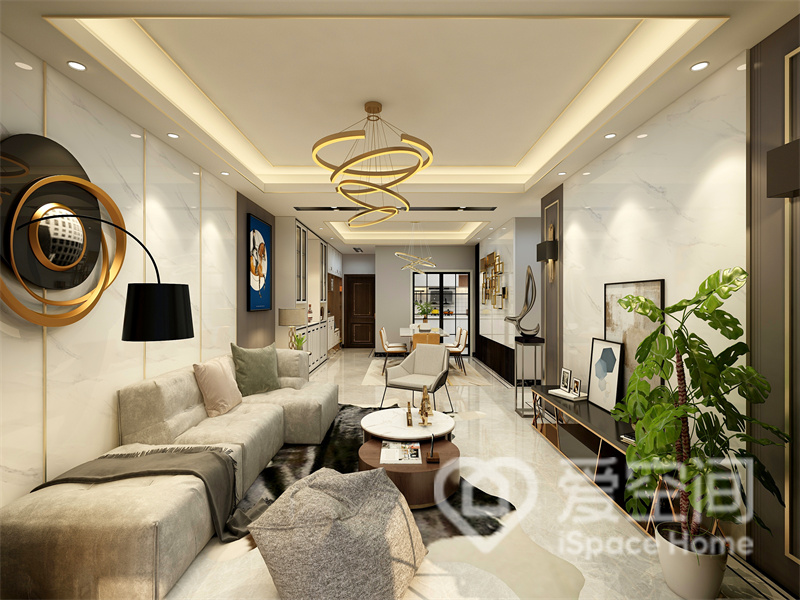 客厅选用低饱和度的米色作为主色调，开放式的布局让空间视野更加开阔，营造出温馨的视觉感受。