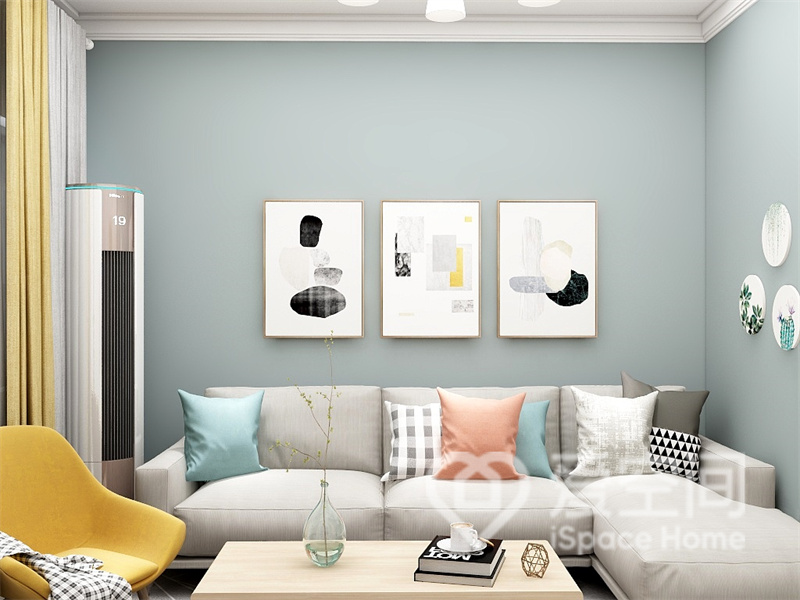 浅蓝色背景墙带来安静浪漫的空间氛围，灰色布艺沙发搭配原木茶几，演绎素雅的北欧魅力。