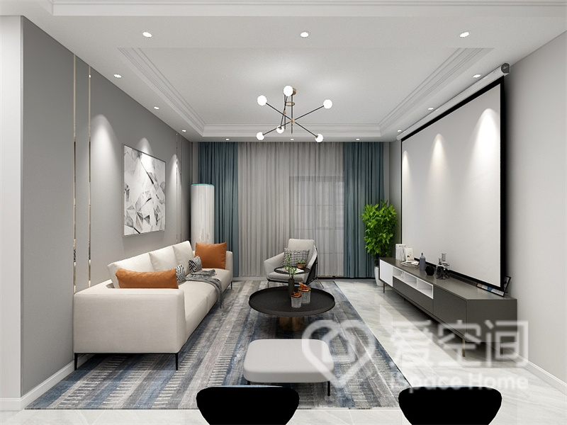 客厅的设计低调随和，灰色护墙板搭配白色沙发独具特色，投影仪代替了传统电视机，彰显出业主的审美品味。