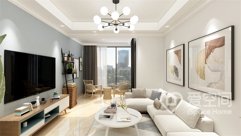富有质感的白色布艺沙发搭配清新装饰画，充分体现出温馨的低奢氛围，浅蓝色电视墙令空间更加浪漫。