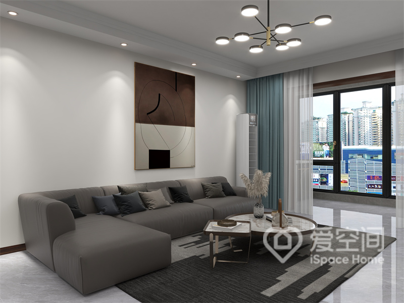 客厅以现代简约风为基调，大面积用暖色为背景，搭配灰色系家具，提高了空间的现代质感。