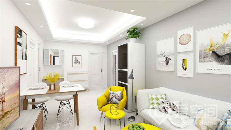 在灰白色空间中，黄色单椅起到一个衬托和点亮的作用，增加了视觉上的对比，让空间看上去更加有活力。