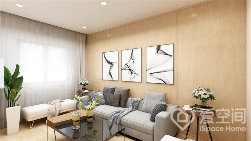 无吊顶手法令客厅更加宽敞，米色背景赋予客厅柔软的氛围，布艺沙发布置其中，增添了高级的质感。