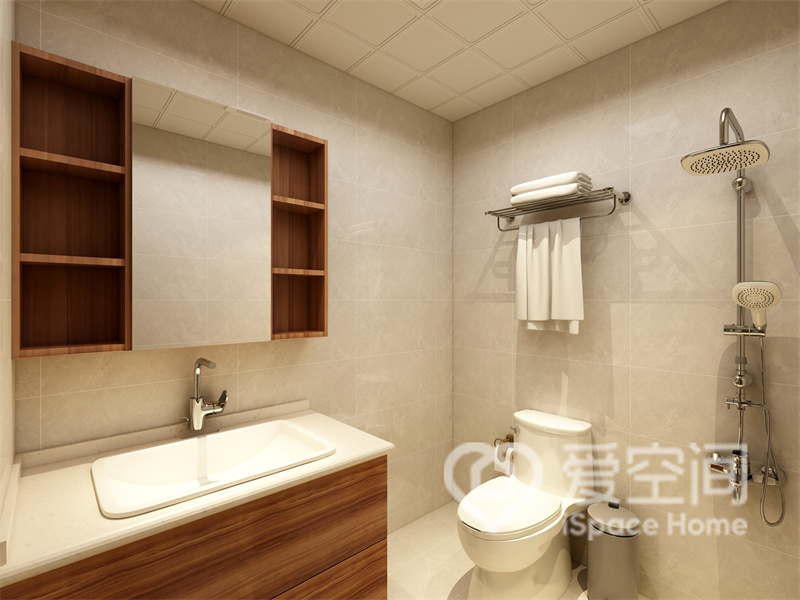 卫浴间选用米色石材为背景，室内加以木材和与金属元素点缀，镜柜具有收纳功能，整个空间更具功能感。