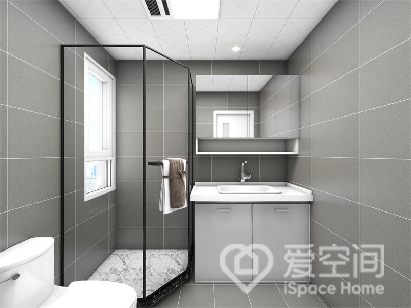 灰色背景中，设计师通过干湿分离来提高业主的生活效率，洗手柜和镜柜都为空间增添了储物空间。