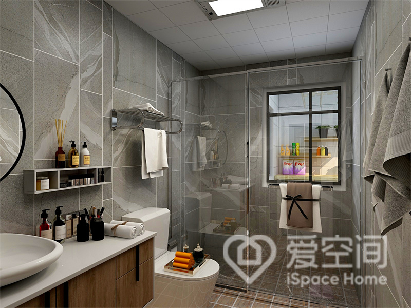 卫生间采用经典的米灰色大理石砖面铺贴背景，点缀白色洁具和原木家具，恰到好处的升华了空间的格调。