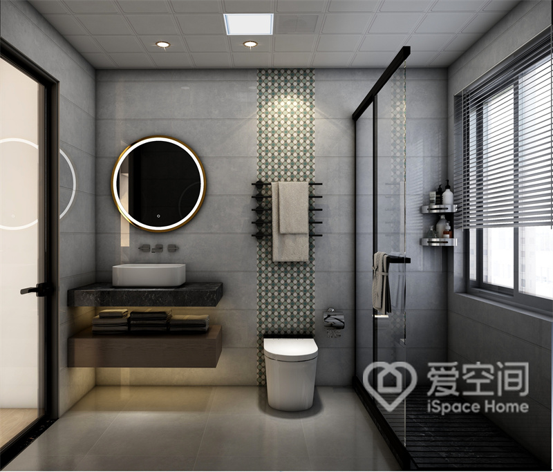 衛浴空間做了干濕分離，灰色調背景打造出充滿沉穩氣息的生活環境，干濕分離劃分出層次美感。