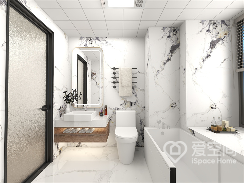 卫生间利用留白技巧，以大理石纹理勾勒其中，配以利落的线条，呈现出洁净清爽的空间氛围。