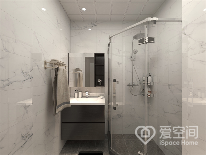 卫生间做了干湿分离，白色石材展现出独特的美感，洗手台悬浮设计，十分轻盈，带来独特的视觉感受。