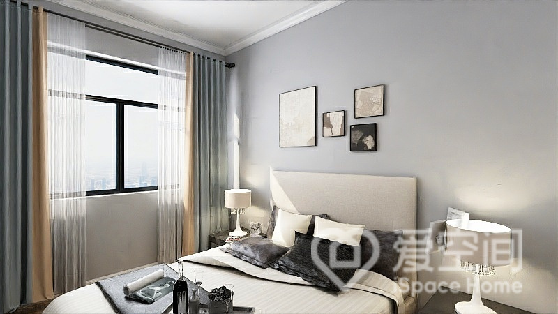 次卧背景为灰色调，空间看起来通透又简约，挂画造型简约，精致小巧，透露着满满的高级感。