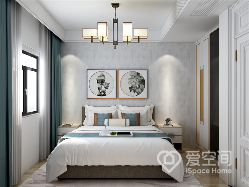 次卧的背景墙带着水墨诗意的美感，搭配简约的新中式家具和装饰元素，给予人怡然之感。