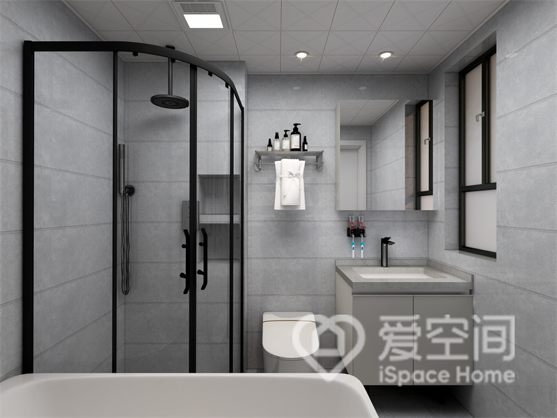 衛浴空間采用大面積淺灰調磚面鋪貼，呈現出簡約舒適的美感，干濕分離提升了空間利用率。
