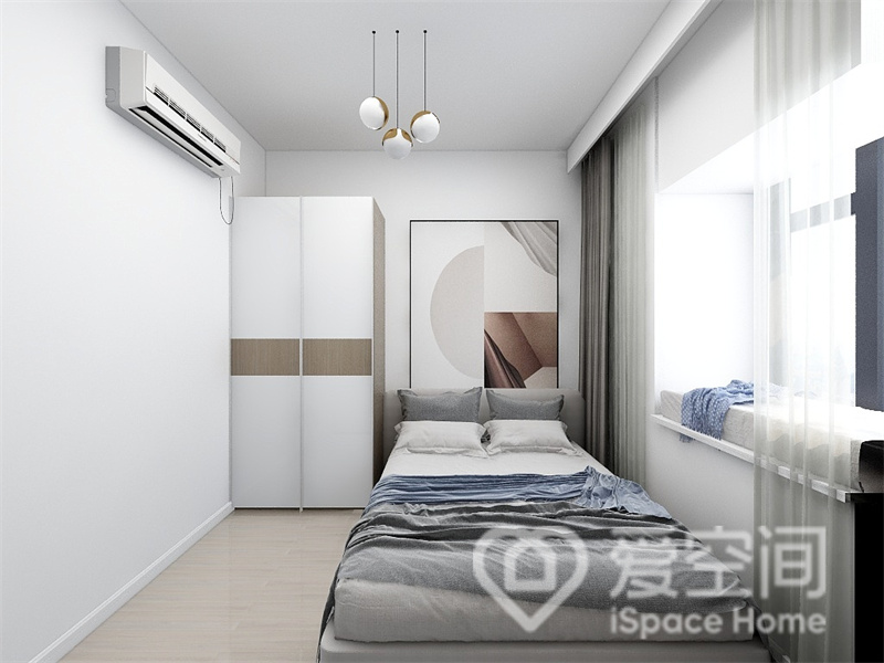 次卧以白色为空间背景，衣柜、装饰画、单人床动线规划有序，诠释出整洁温馨的卧室格调。