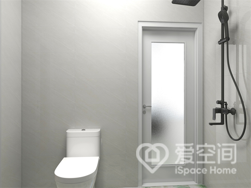 卫生间的干湿分离布局特别合理，壁挂式的淋浴器款式新颖，白色马桶将时尚氛围感展现了出来。