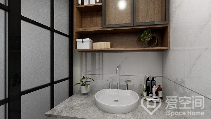 卫生间以白为基调，大理石砖面更添几分灵动，配以木质收纳柜，给整个空间带来一股清雅、愉悦的视觉。