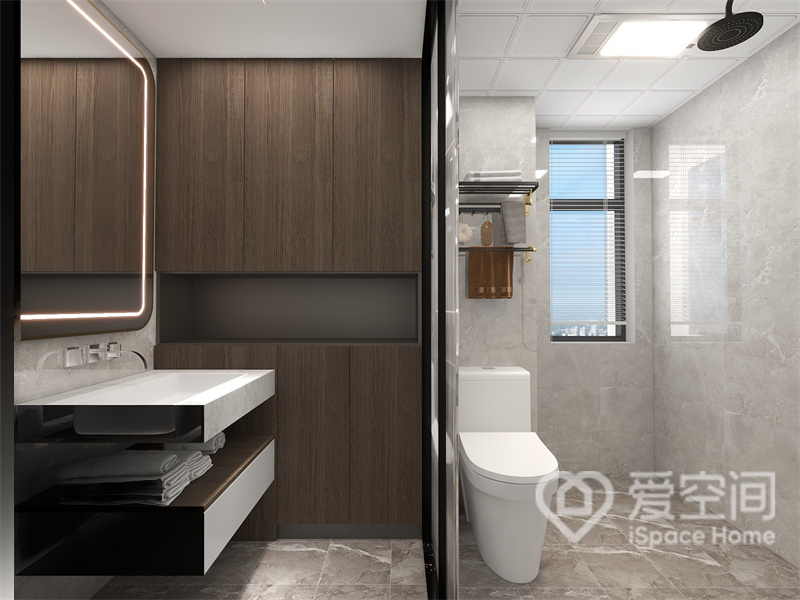 卫生间采用线性结构设计，干湿分离扩大了卫生间的空间感，木质收纳柜的融入为空间增添了一丝温暖。
