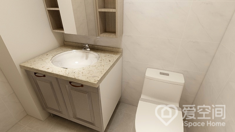 卫生间的设计简洁却又不单调，镜柜、洗手柜、坐便器有序放置，营造出宁静而唯美的生活空间。