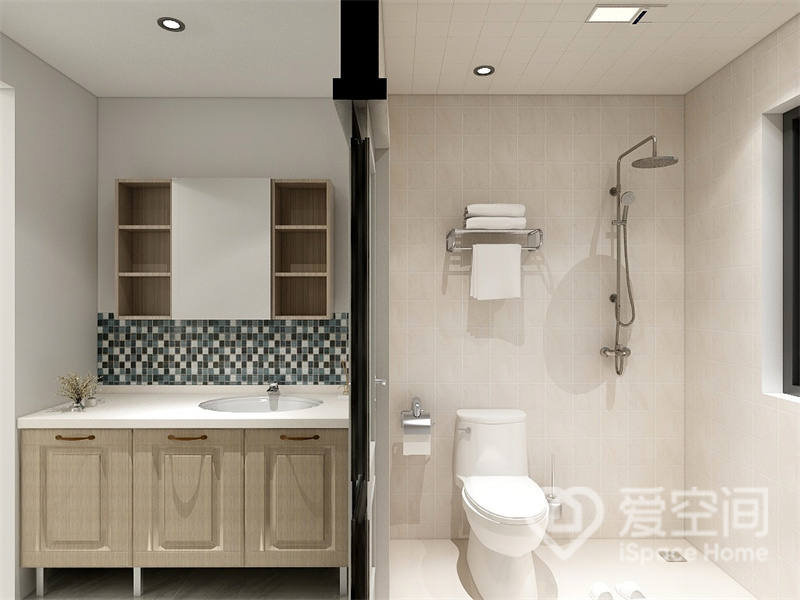 卫浴空间层次分明，马桶和淋浴器一字型布置，方便使用，干湿分离后空间显得更有层次感。