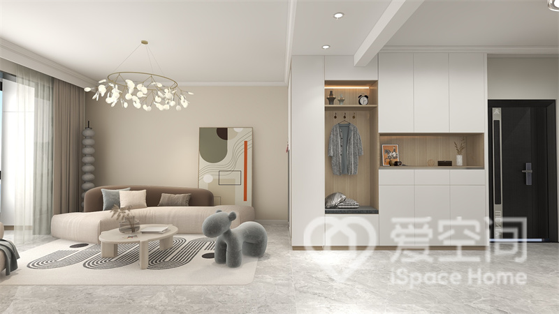 客廳空間中，設計師選擇了奶茶色作為背景，空間呈現出簡約的質感。