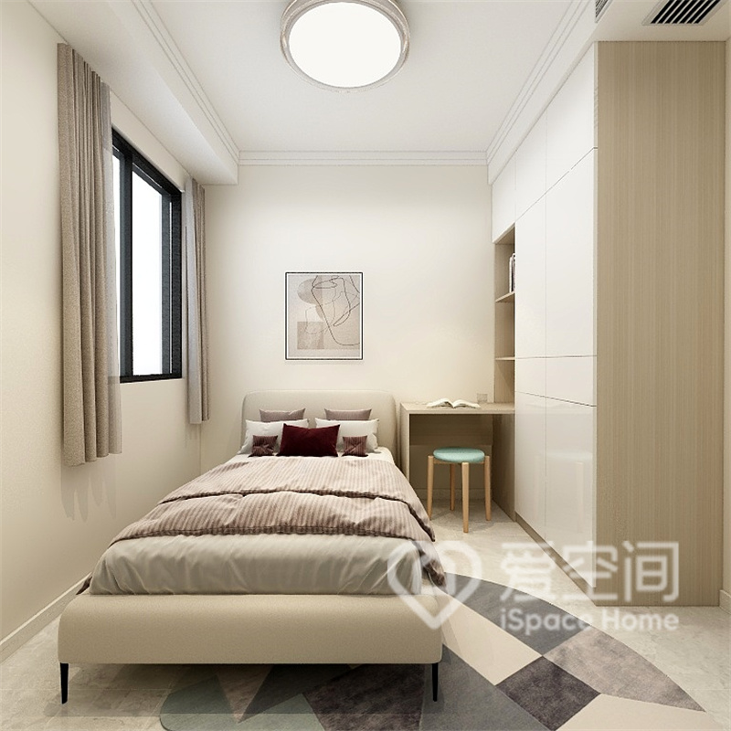 次臥的設計以奶茶色為主色調，提柜采用定制的方式設計，展現出了空間的高級感。