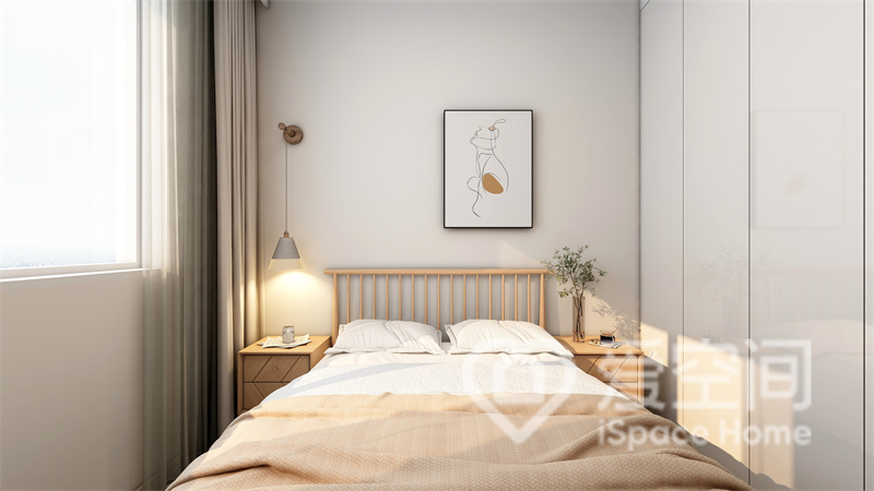 次卧以白色为背景墙，搭配暖色床品和垂吊灯具，空间变得更加温馨舒适。