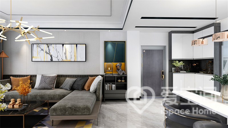 灰白色背景与棕绿色沙发搭配，令客厅透露着简洁大方的氛围，时尚且和谐。