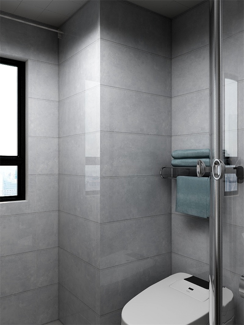 衛生間簡約寬綽，灰色磚面搭配白色潔具，令空間顯得更加整潔明朗。