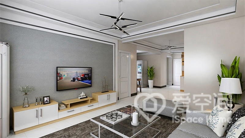 电视墙以灰色涂料为背景，搭配原木材质的地柜，空间集摩登时尚感于一体。