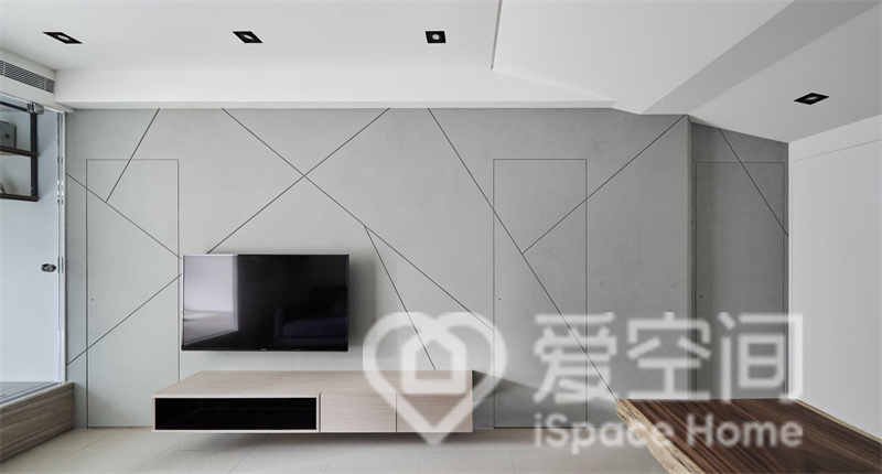 電視墻簡單素雅，設計師用大量的純色來塑造背景，并有幾何線條進行勾勒