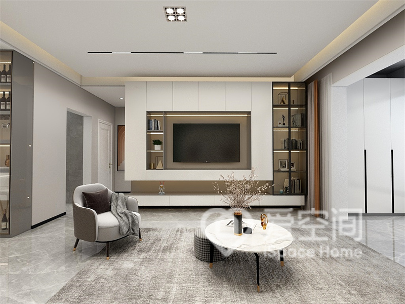 浅色电视墙不仅能让客厅视觉感更大，局部的收纳柜也提升了空间的层次。