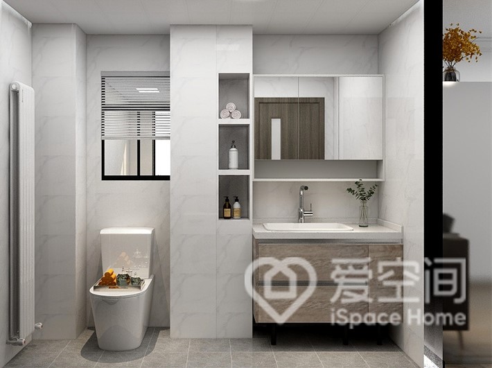 设计师巧妙利用墙体隔断将卫生间“一分为二”，坐便器与洗手台布局隔而不断，方便日常使用。