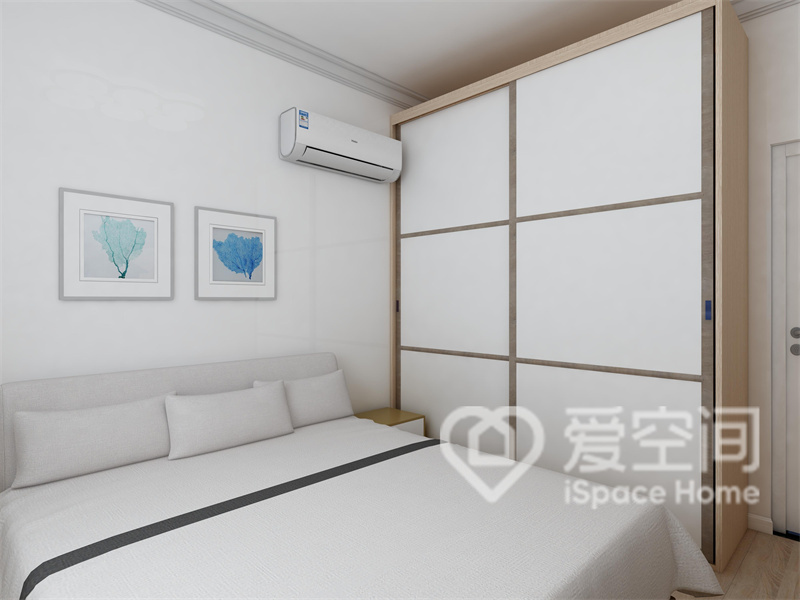 次卧以白色为空间主基调，背景墙、床品和衣柜柜面都选用白色，无形中令卧室空间更加明朗。