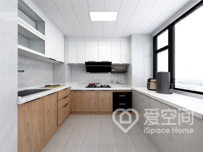 厨房以灰白色砖面作为背景，橱柜采用浑然天成的材质定做，纹理细腻美观，空间动线规划舒适合理。