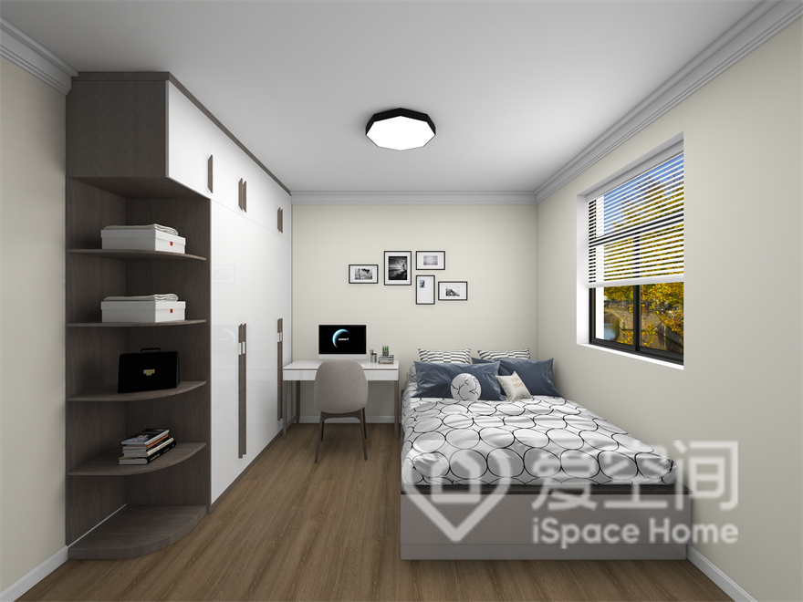 次卧立面造型简单，定制柜增加了空间层次感，局部加以装饰画作点缀，营造出舒适的空间氛围。