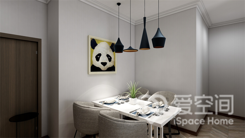 白色调的餐厅空间带来视觉中的宁静感，餐桌椅简单又低调，灯具气质略显高级，装饰画成为点睛之笔。