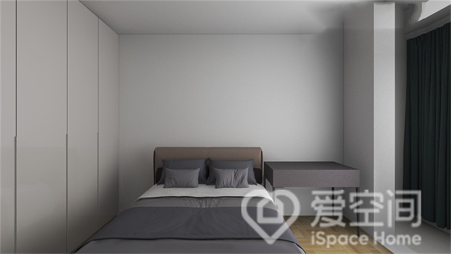 整个次卧空间采用白灰色调，营造出干净温和的视觉观感，隐形衣柜材质自然且充满干练气质。