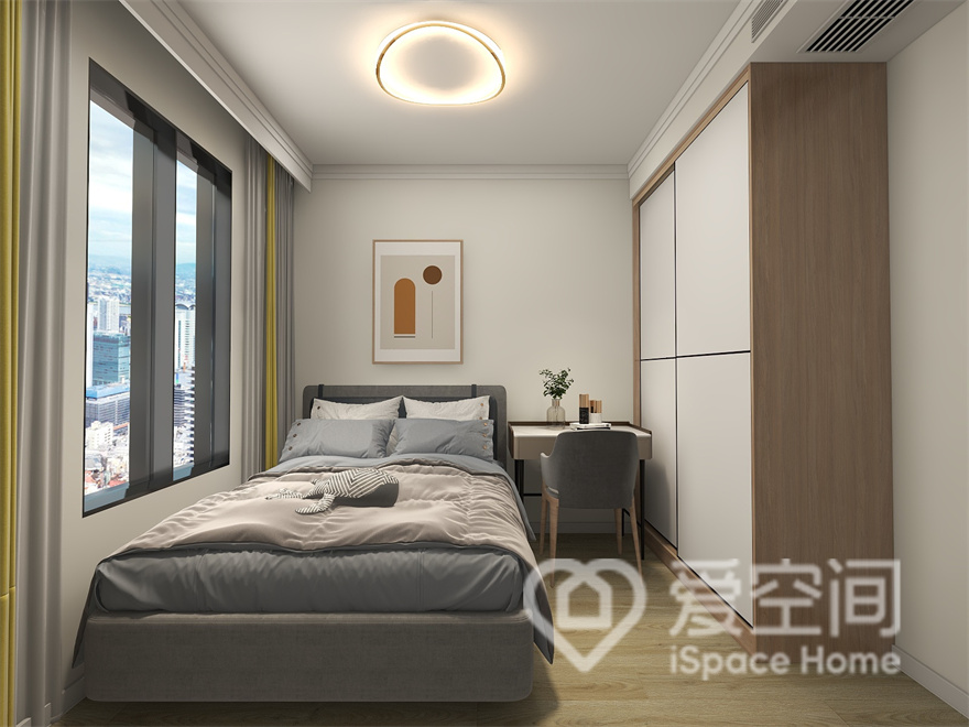 次卧的设计符合时代的潮流气息，灰色与蓝色在空间中对话，塑造出安静、温馨的空间特点。