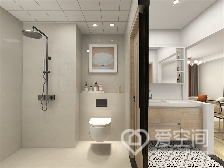 卫生间的设计简约，层次分明，洗手台外移设计，如此一来坐便区和淋浴区的使用面积得到扩大。