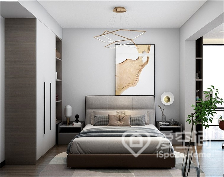 次卧的设计精简干练，空间中多适用白与灰单色色调简单碰撞，加以艺术装饰画点缀，空间明媚且温暖。